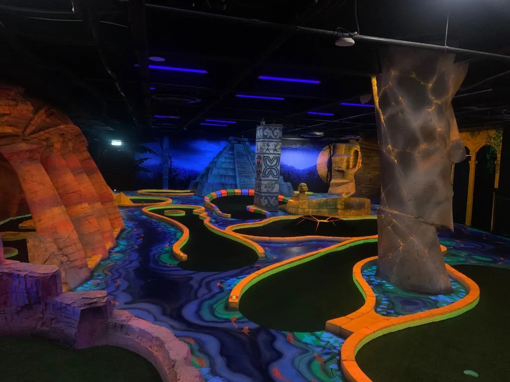 Indoor blacklight miniature golf course